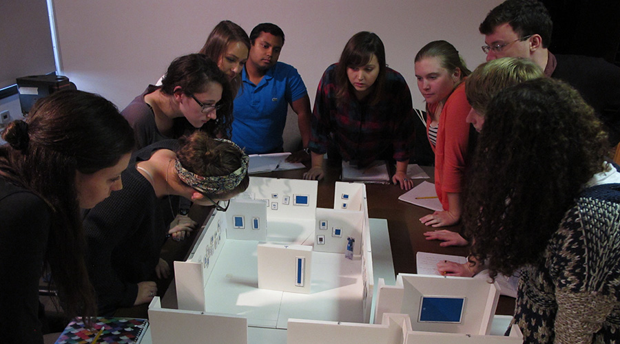 students looking over art history