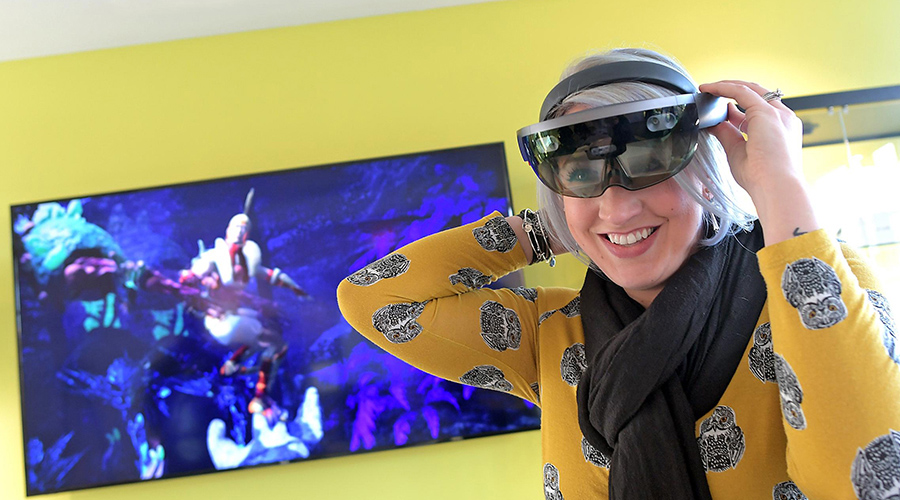 interactive media design student putting on head set