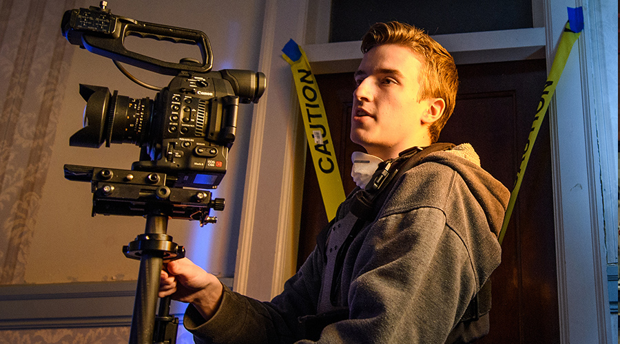 screen studies student behind camera