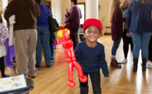 little kid with balloon