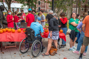Families decorate pumpkins