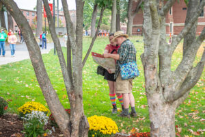a student and his father refer to a map