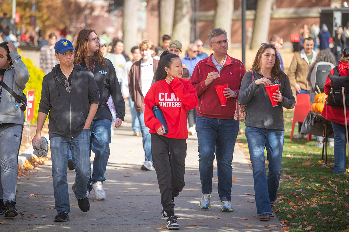 families walking across campus