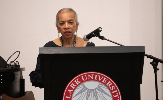 Student behind podium speaking