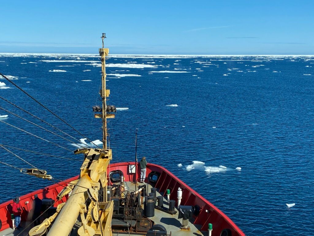 Ella Christie on the prow of the CCGS Sir Wilfred Laurier