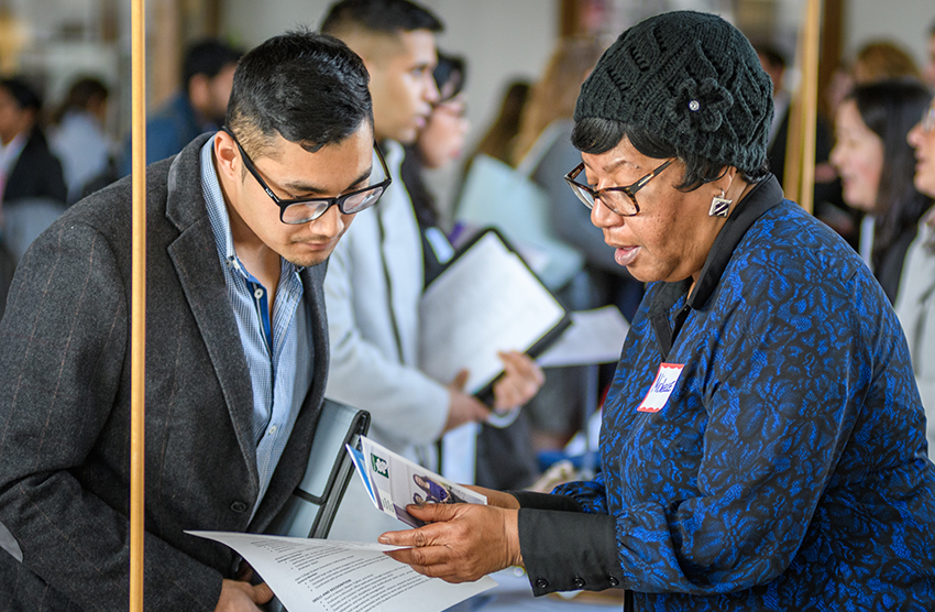Student talking to employer