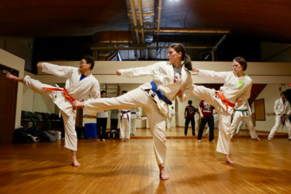 Students kicking in karate