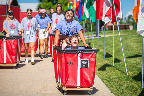 Students pushing carts